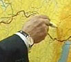 Владимир Путин указывает, где должна пройти труба. Фото с сайта Newsru.com